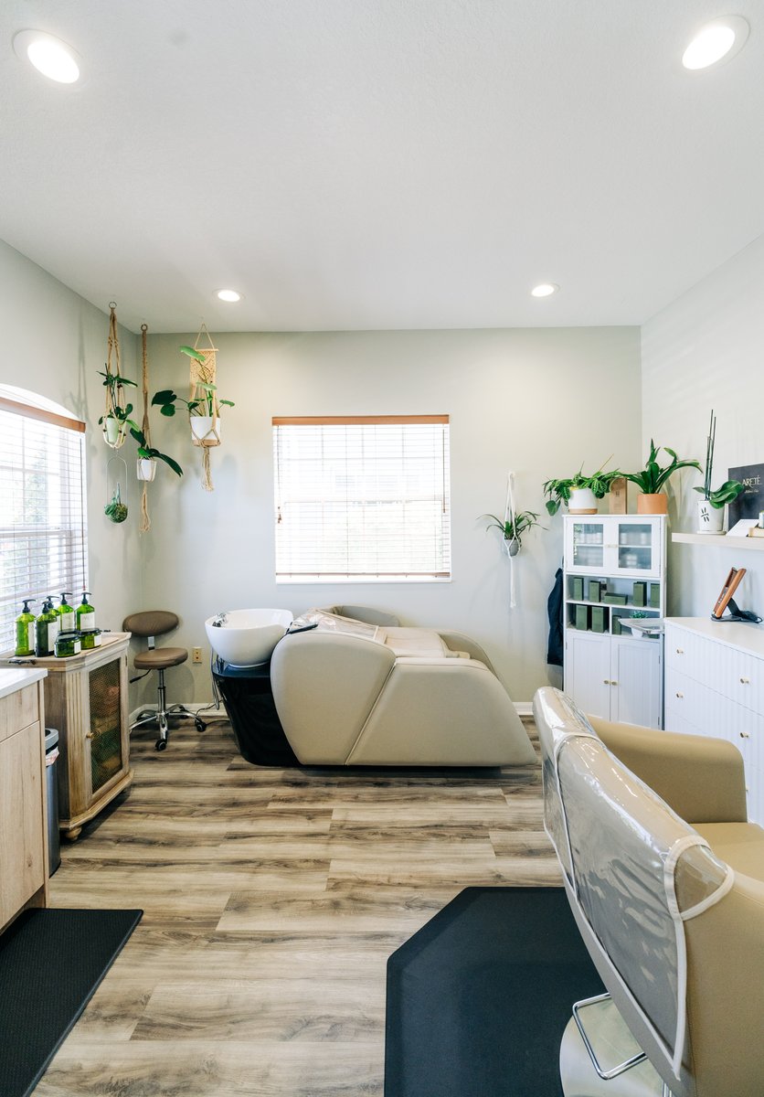 Shampoo bowls and styling chairs on the salon floor