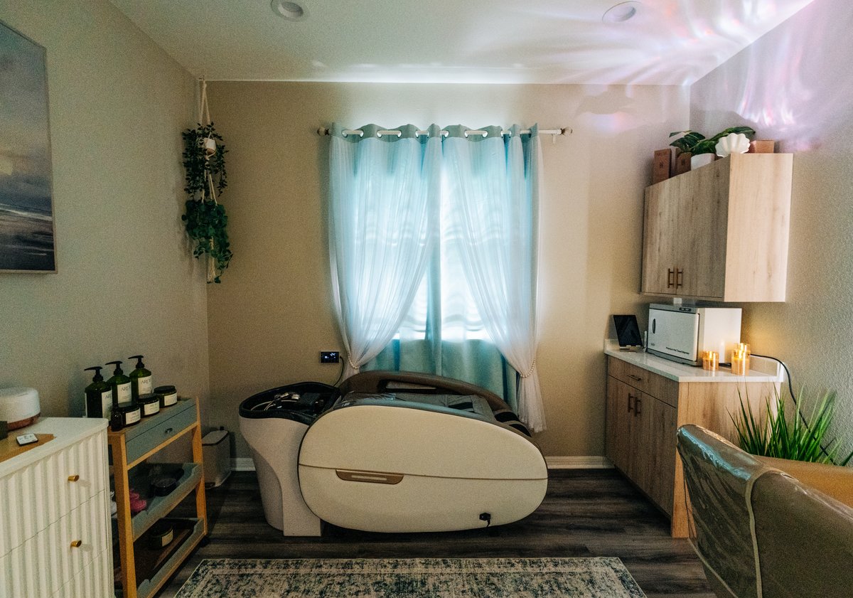 Second head spa suite with treatment pod and sheer curtains